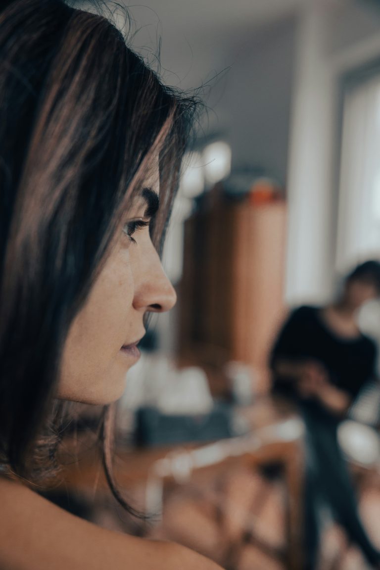 A woman is looking at her cell phone